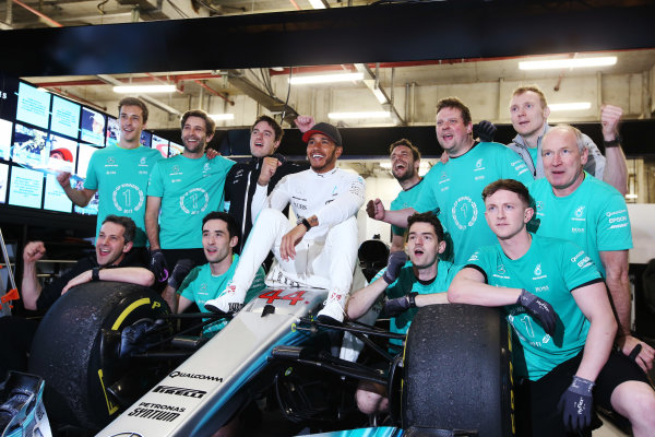 Shanghai International Circuit, Shanghai, China.  Sunday 09 April 2017. 
Lewis Hamilton, Mercedes AMG, celebrates victory with colleagues, sitting on his car.
World Copyright: Charles Coates/LAT Images 
ref: Digital Image AN7T0991