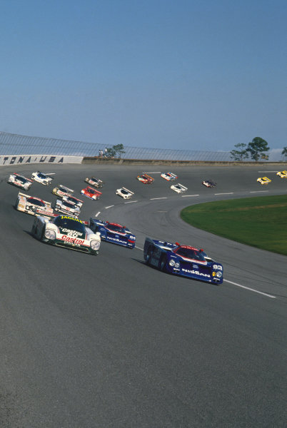 Daytona 24 hours, Florida, USA. 4th - 5th February 1989. Rd 1.
Davy Jones/Raul Boesel/Jan Lammers (Jaguar XJR-9), retired, leads Geoff Brabham/Chip Robinson/Arie Luyendyk/Michael Roe (Nissan GTP ZX-Turbo), retired, at the start, action.  
World Copyright: LAT Photographic.
Ref: 89IMSA DAY01.