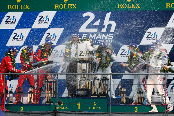 2015 Le Mans 24 Hours. Circuit de la Sarthe, Le Mans, France.
Sunday 14 June 2015.
Porsche Team (Porsche 919 Hybrid - LMP1), Nico Hulkenberg, Earl Bamber, Nick Tandy, Porsche Team (Porsche 919 Hybrid - LMP1), Timo Bernhard, Mark Webber, Brendon Hartley & Audi Sport Team Joest (Audi R18 E-Tron Quattro - LMP1), Marcel Fassler, Andre Lotterer, Benoit Treluyer, celebrate on the podium
Photo:  Sam Bloxham/LAT Photographic.
ref: Digital Image _SBL2545