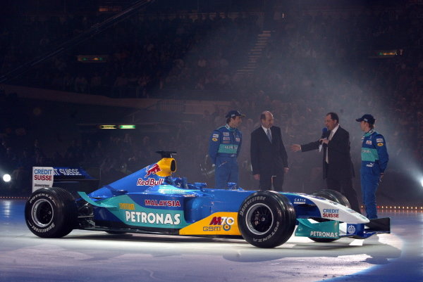 The new Sauber C22 is paraded on an ice rink with key dignitaries (L to R): Heinz-Harald Frentzen (GER) Sauber; Peter Sauber (SUI) Sauber Team Owner; Nick Heidfeld (GER) Sauber.   
Sauber Petronas C22 Launch, Swissotel, Hinwil, Switzerland, 9 February 2003.
DIGITAL IMAGE