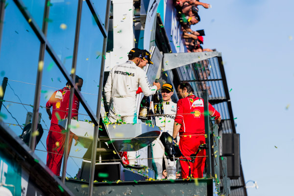 Albert Park, Melbourne, Australia.
Sunday 26 March 2017.
Sebastian Vettel, Ferrari, 1st Position, Lewis Hamilton, Mercedes AMG, 2nd Position, and Valtteri Bottas, Mercedes AMG, 3rd Position, celebrate on the podium.
World Copyright: Zak Mauger/LAT Images
ref: Digital Image _56I1990 Albert Park, Melbourne, Australia.
Sunday 26 March 2017.
Sebastian Vettel, Ferrari, 1st Position, Lewis Hamilton, Mercedes AMG, 2nd Position, and Valtteri Bottas, Mercedes AMG, 3rd Position, celebrate on the podium.
World Copyright: Zak Mauger/LAT Images
ref: Digital Image _56I1990