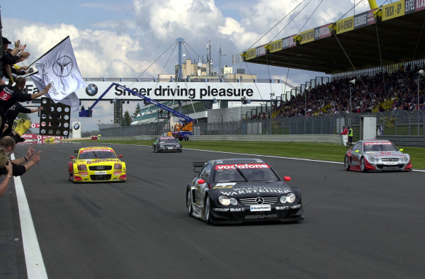 2002 DTM Championship 
Nurburgring, Germany. 2th - 4th August 2002. 
Uwe Alzen (Mercedes CLK-DTM) crosses the finissh line in 1st position, with Laurent Aiello (Abt Audi TT-R) 2nd and Bernd Schneider 3rd.
World Copyright: Andre Irlmeier/LAT Photographic



