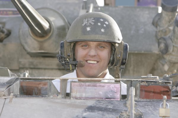 2007 Australian V8 Supercars.
Bahrain International Circuit. Sakhir, Bahrain.
2nd - 4th November. 
Jason Bright  at the wheel of armored troop carriers  during a visit to the Australian troops based at Tallil Airbase located approximately 310 kilometers Southeast of Baghdad, Iraq.
World Copyright: Mark Horsburgh/LAT Photographic. 
Ref: Digital Image V8-Drivers-IRAQ-6991