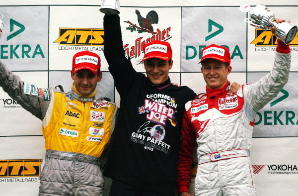 Podium of the Saturday race. Winner and 2002 champion: Gary Paffett (GBR), Team Rosberg, centre; 2nd: Timo Glock (GER) Opel Team KMS, left; 3rd: Ryan Briscoe (AUS), Prema Powerteam, right.
German Formula 3 Championship, Rd10, Hockenheim, Germany, 5-6 October 2002.
DIGITAL IMAGE Podium of the Saturday race. Winner and 2002 champion: Gary Paffett (GBR), Team Rosberg, centre; 2nd: Timo Glock (GER) Opel Team KMS, left; 3rd: Ryan Briscoe (AUS), Prema Powerteam, right.
German Formula 3 Championship, Rd10, Hockenheim, Germany, 5-6 October 2002.
DIGITAL IMAGE