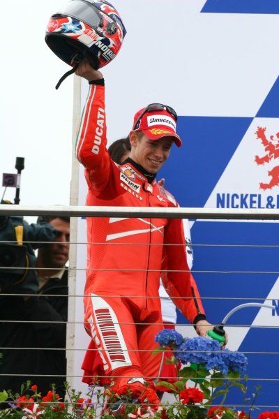 2007 Moto GP British Grand Prix.
Donington Park, England.
22nd-24th June 2007.
Casey Stoner (Ducati Marlboro Team, Ducati Desmosedici GP7)  celebrates another win on the podium, portrait.
World Copyright: Kevin Wood/LAT Photographic
ref: Digital Image IMG_6399