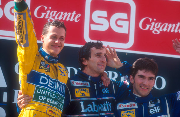 Estoril, Portugal.
24-26 September 1993.
Michael Schumacher (Benetton Ford) celebrates 1st position on the podium with Alain Prost, 2nd position and Damon Hill, 3rd position (both Williams Renault).
Ref-93 POR 11.
World Copyright - LAT Photographic