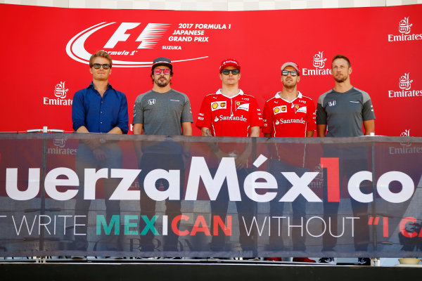 Suzuka Circuit, Japan.
Sunday 08 October 2017.
Nico Rosberg, Fernando Alonso, McLaren, Kimi Raikkonen, Ferrari, Sebastian Vettel, Ferrari, and Jenson Button take part in an event in support of Mexico on the podium.
World Copyright: Andy Hone/LAT Images 
ref: Digital Image _ONY8412