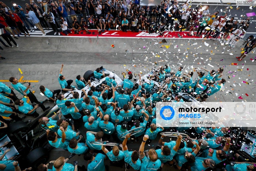 The Mercedes team celebrates victory in the race and the Constructors championship The Mercedes team celebrates victory in the race and the Constructors championship