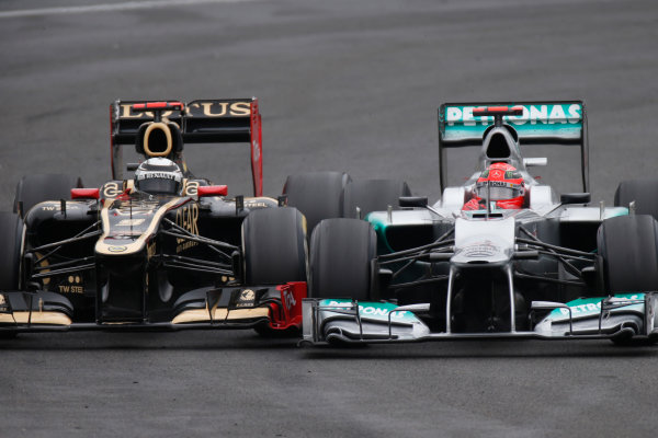 Interlagos, Sao Paulo, Brazil.
Sunday 25th November 2012.
Michael Schumacher, Mercedes F1 W03, battles with Kimi Raikkonen, Lotus E20 Renault. 
World Copyright:Glenn Dunbar/LAT Photographic
ref: Digital Image _89P9000