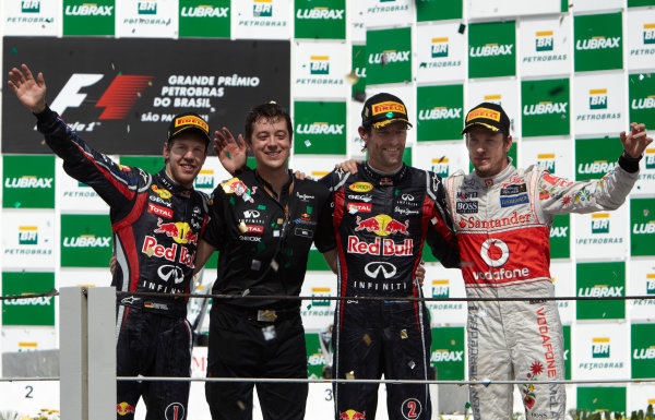 Interlagos, Sao Paulo, Brazil.
27th November 2011.
Sebastian Vettel, Red Bull Racing RB7 Renault, 2nd position, Will Courtney, Strategist, Red Bull, Mark Webber, Red Bull Racing RB7 Renault, 1st position, and Jenson Button, McLaren MP4-26 Mercedes, 3rd position. Portrait. Podium. 
World Copyright: Steve Etherington/LAT Photographic
ref: Digital Image SNE28405