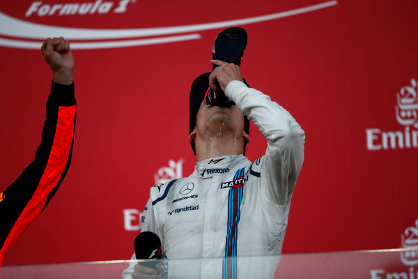 Baku City Circuit, Baku, Azerbaijan.
Sunday 25 June 2017.
Lance Stroll, Williams Martini Racing, 3rd Position, drinks from the shoe of winner Daniel Ricciardo, Red Bull Racing, 1st Position, on the podium.
World Copyright: Andrew Hone/LAT Images
ref: Digital Image _ONY9189