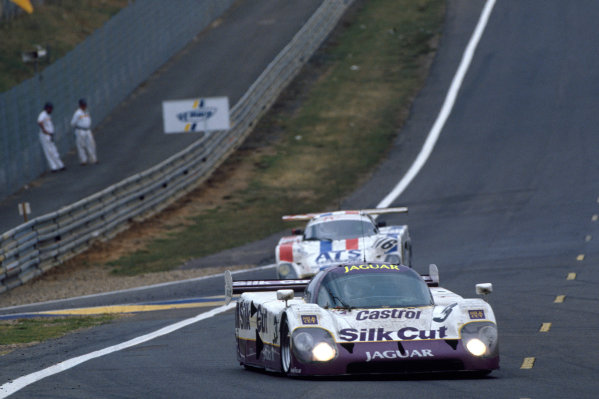 Le Mans, France. 16th - 17th June 1990.
John Nielsen/Price Cobb/Eliseo Salazar/Martin Brundle (Jaguar XJR-12), 1st position, leads Richard Piper/Olindo Iacobelli/Mike Youles (Spice SE89C Ford), 21st position, action.
World Copyright: LAT Photographic.
Ref: 90LM Le Mans, France. 16th - 17th June 1990.
John Nielsen/Price Cobb/Eliseo Salazar/Martin Brundle (Jaguar XJR-12), 1st position, leads Richard Piper/Olindo Iacobelli/Mike Youles (Spice SE89C Ford), 21st position, action.
World Copyright: LAT Photographic.
Ref: 90LM
