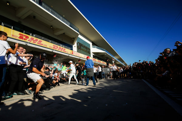 Circuit of the Americas, Austin, Texas, United States of America.
Sunday 22 October 2017.
Niki Lauda, Non-Executive Chairman, Mercedes AMG, Lewis Hamilton, Mercedes AMG, and Valtteri Bottas, Mercedes AMG, spray the champagne with the rest of the team as they celebrate Constructors’ Championship victory.
World Copyright: Zak Mauger/LAT Images
ref: Digital Image _X0W7332 Circuit of the Americas, Austin, Texas, United States of America.
Sunday 22 October 2017.
Niki Lauda, Non-Executive Chairman, Mercedes AMG, Lewis Hamilton, Mercedes AMG, and Valtteri Bottas, Mercedes AMG, spray the champagne with the rest of the team as they celebrate Constructors’ Championship victory.
World Copyright: Zak Mauger/LAT Images
ref: Digital Image _X0W7332