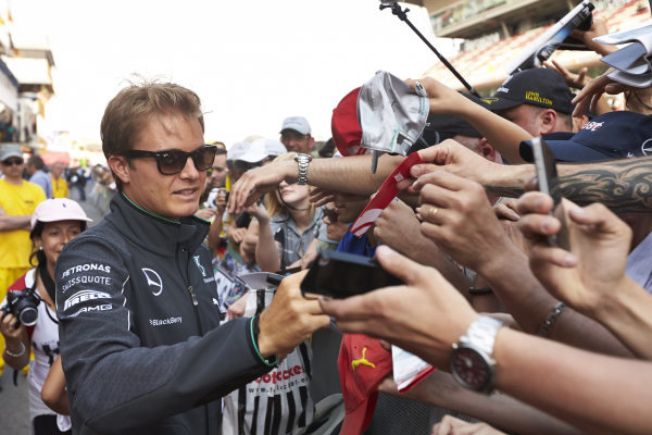 Circuit de Catalunya, Barcelona, Spain.
Thursday 8 May 2014.
Nico Rosberg, Mercedes AMG, signs autographs for fans.
World Copyright: Steve EtheringtonLAT Photographic.
ref: Digital Image SNE11677 copy