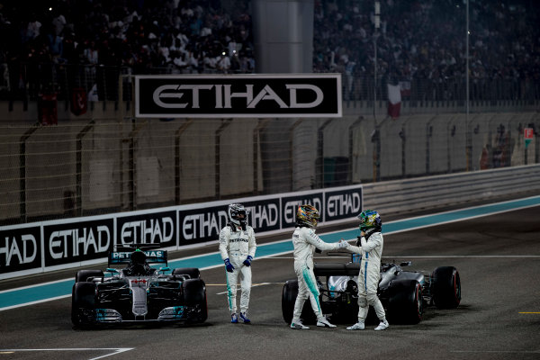 Yas Marina Circuit, Abu Dhabi, United Arab Emirates.
Sunday 26 November 2017.
Valtteri Bottas, Mercedes AMG, 1st Position, Lewis Hamilton, Mercedes AMG, 2nd Position, and Felipe Massa, Williams Martini Racing, celebrate on the grid at the end of the race.
World Copyright: Glenn Dunbar/LAT Images 
ref: Digital Image _31I9287