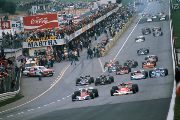 Osterreichring, Zeltweg, Austria. 13th - 15th August 1976. 
John Watson (Penske PC4-Ford), 1st position leads James Hunt (McLaren M23-Ford), 4th position, at the start of the race, action.
World Copyright: LAT Photographic 
Ref: 76 AUT 16.