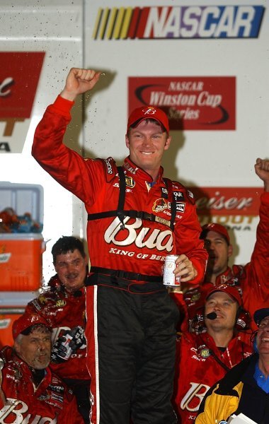 Race winner Dale Earnhardt Jr (USA) Budweiser Chevrolet celebrates his exhibition race victory on the podium. 
Budweiser Shootout, Daytona International Speedway, Florida, USA, 8 February 2003.
DIGITAL IMAGE
