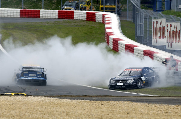 2002 DTM Championship 
Nurburgring, Germany. 2th - 4th August 2002. 
Jean Alesi (Mercedes CLK-DTM) spins into the tyre wall after colliding with Alain Menu (Opel Astra V8 Coupe), action.
World Copyright: Andre Irlmeier/LAT Photographic

