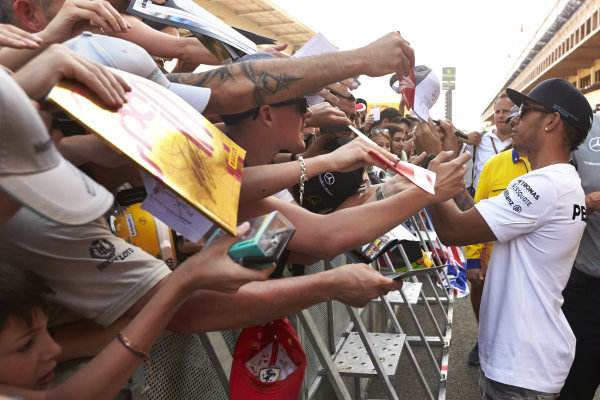 Circuit de Catalunya, Barcelona, Spain.
Thursday 8 May 2014.
Lewis Hamilton, Mercedes AMG, signs autographs for fans.
World Copyright: Steve EtheringtonLAT Photographic.
ref: Digital Image SNE11803 copy