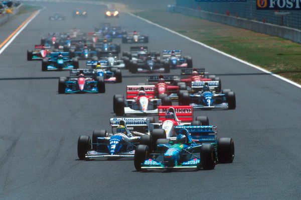Tanaka International, Aida, Japan.
15-17 April 1994.
Michael Schumacher (Benetton B194 Ford) leads Ayrton Senna (Williams FW16 Renault), Mika Hakkinen, Martin Brundle (both McLaren MP4/9 Peugeot's) and Damon Hill (Williams FW16 Renault) at the start.
Ref-94 PAC 15.
World Copyright - LAT Photographic Tanaka International, Aida, Japan.
15-17 April 1994.
Michael Schumacher (Benetton B194 Ford) leads Ayrton Senna (Williams FW16 Renault), Mika Hakkinen, Martin Brundle (both McLaren MP4/9 Peugeot's) and Damon Hill (Williams FW16 Renault) at the start.
Ref-94 PAC 15.
World Copyright - LAT Photographic