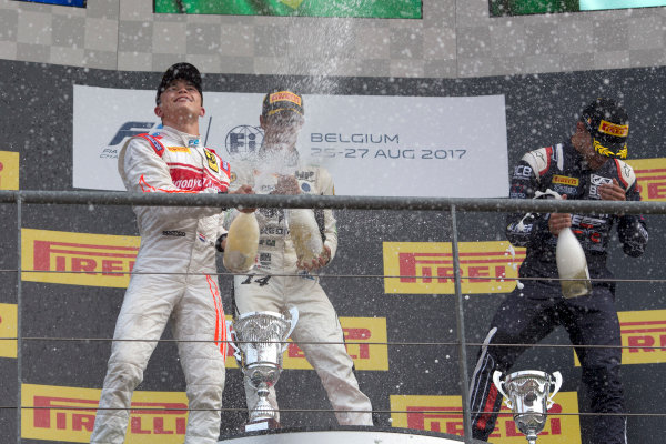 2017 FIA Formula 2 Round 8.
Spa-Francorchamps, Spa, Belgium.
Sunday 27 August 2017.
Sergio Sette Camara (BRA, MP Motorsport) celebrates his victory on the podium with Nyck De Vries (NED, Racing Engineering) and Luca Ghiotto (ITA, RUSSIAN TIME). 
Photo: Alastair Staley/FIA Formula 2.
ref: Digital Image _L5R6085