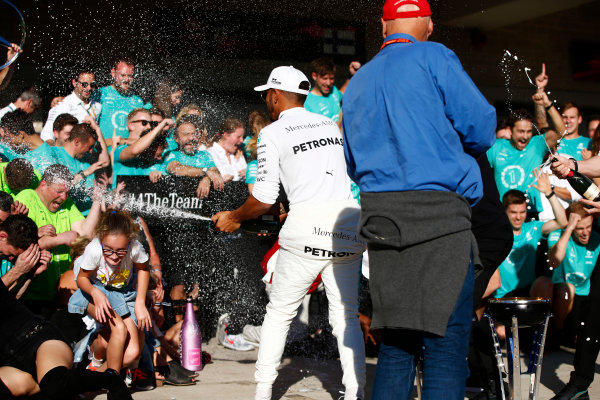 Circuit of the Americas, Austin, Texas, United States of America.
Sunday 22 October 2017.
Lewis Hamilton, Mercedes AMG, and Niki Lauda, Non-Executive Chairman, Mercedes AMG, spray the champagne as they celebrate Constructors’ Championship victory with the rest of the team.
World Copyright: Andy Hone/LAT Images 
ref: Digital Image _ONY2560