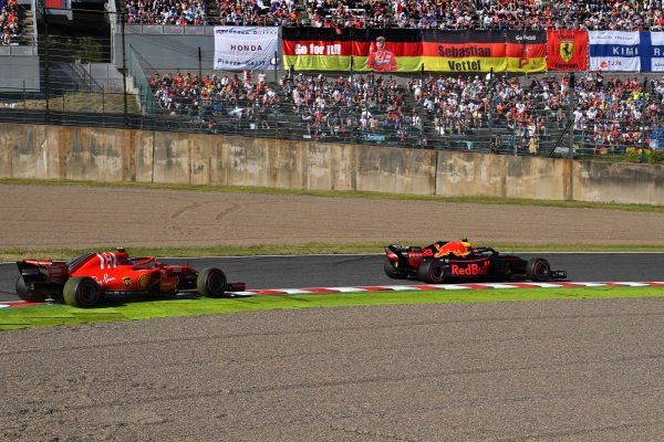 Kimi Raikkonen, Ferrari SF71H and Max Verstappen, Red Bull Racing RB14
