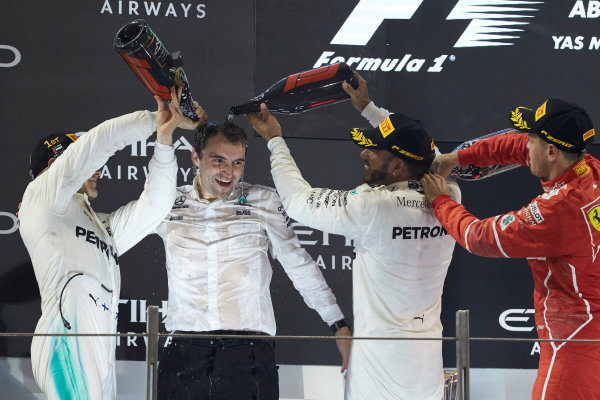 Yas Marina Circuit, Abu Dhabi, United Arab Emirates.
Sunday 26 November 2017.
Lewis Hamilton, Mercedes AMG, 2nd Position, Valtteri Bottas, Mercedes AMG, 1st Position, and Sebastian Vettel, Ferrari, 3rd Position, celebrate on the podium.
World Copyright: Steve Etherington/LAT Images 
ref: Digital Image SNE13332