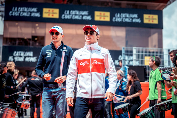 Esteban Ocon (FRA) Force India F1 and Charles Leclerc (MON) Alfa Romeo Sauber F1 Team on the drivers parade